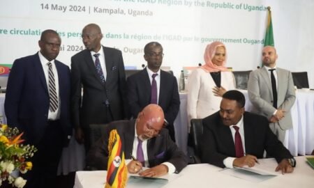 Gen. Jeje Odongo, Uganda’s Minister of Foreign Affairs appends his signature to the protocol on free movement of citizens in the IGAD region on May 14 in Kampala