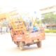 A tuk- tuk carrying luggage