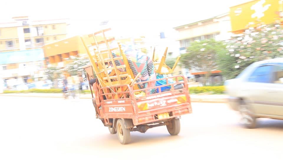 A tuk- tuk carrying luggage