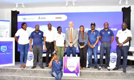 FlexiPay, IFAD and Upesi Money Transfer Teams pose for a group photo after the launch at Amin Pasha Hotel in Kampala.