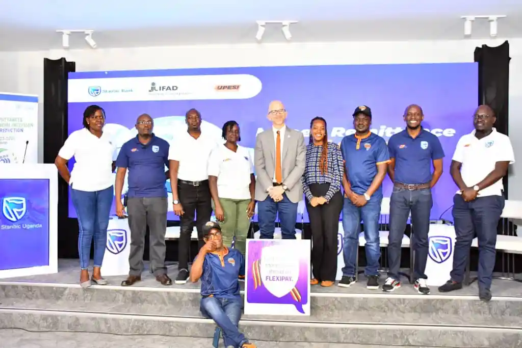 FlexiPay, IFAD and Upesi Money Transfer Teams pose for a group photo after the launch at Amin Pasha Hotel in Kampala.