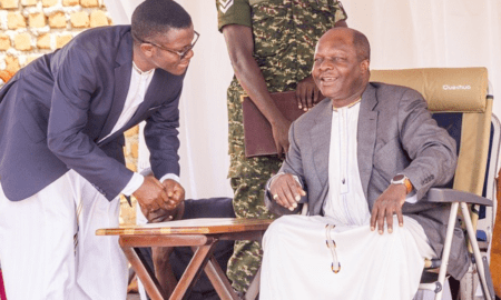 Katikkiro Charles Mayiga consults with the Kabaka